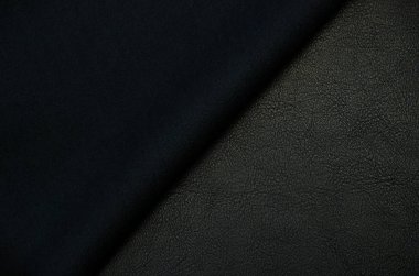 Siyah yapay deri. Pvc tabanında dalgalar ve kıvrımlar var.