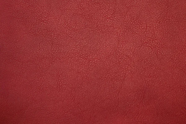 Red artificial leather with waves and folds on PVC base — Stock Photo, Image