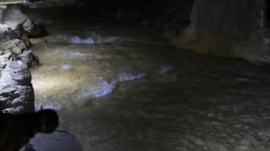 tourists in cavern, Cernica, Slovenia, underground, cave, grotto, dark, people, rock, stone, underground river,
