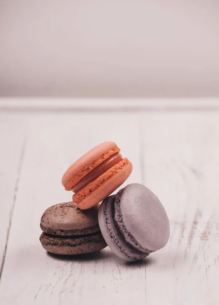 Traditional french dessert of colorful macaron set on white table background. Delicious sweet food.