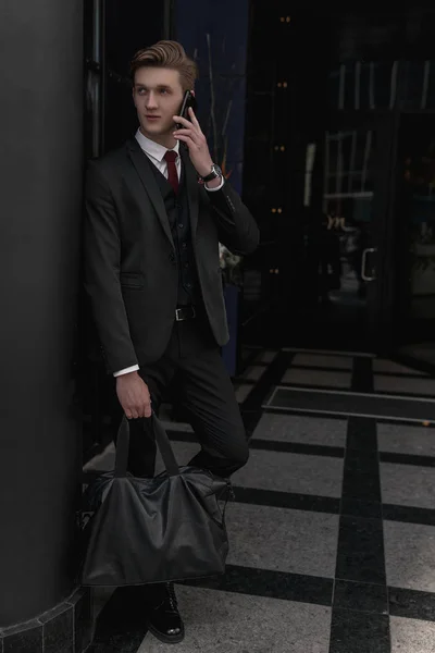 Businessman street. Phone. Business concept. Suit. Success. Young manager. Stylish male. Classic clothes