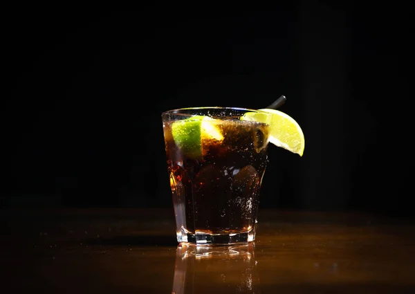 Fresh cocktail on a black background. Alcoholic cocktail on a black background. Fruit with a cocktail. Non-alcoholic cocktail. Mix of cocktails on a black background.