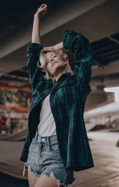 Hipster Girl with Long Blonde Hair Wearing Trendy Plaid Jacket Posing at  Street. Urban Clothing Style Stock Photo - Image of portrait, model:  184615262