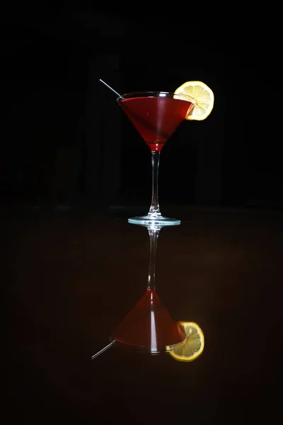 Fresh cocktail on a black background. Alcoholic cocktail on a black background. Fruit with a cocktail. Non-alcoholic cocktail. Mix of cocktails on a black background.