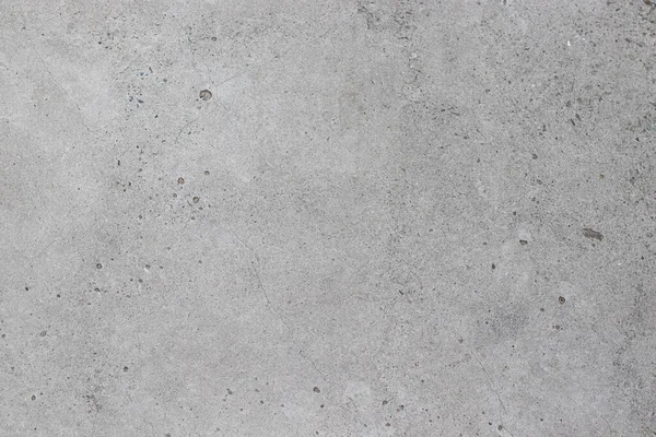 Küçük noktalı beton gri doku.