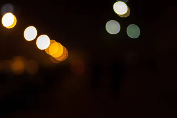 Abstract beeld van bokeh witte en oranje lichten in de stad — Stockfoto