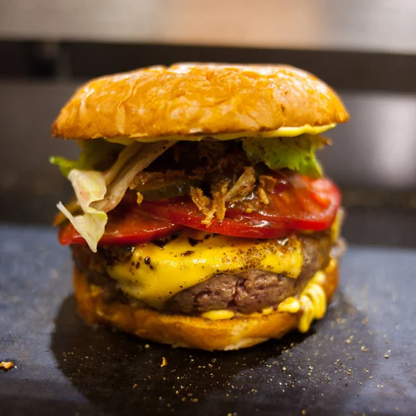 Burger on grill pan close up. Shallow depth of field.