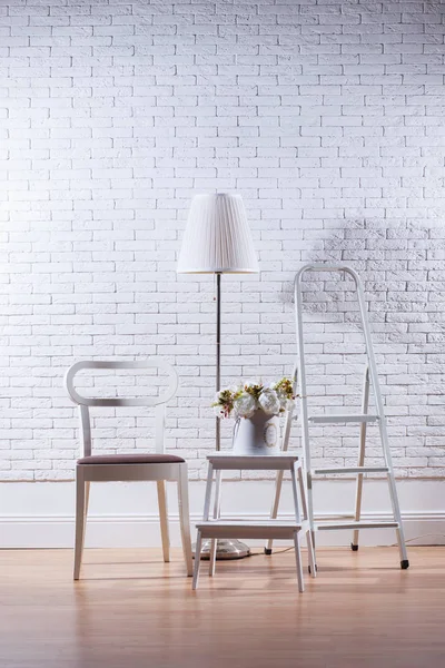 House decor in front of white brick wall, mockup concept