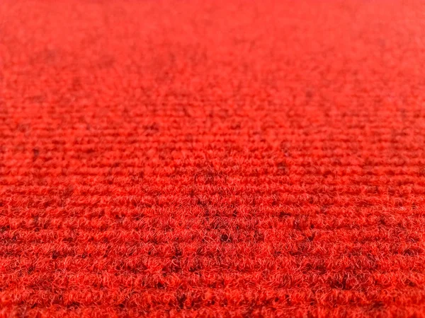 Fondo de alfombra de lana roja con vista de perspectiva, enfoque selectivo — Foto de Stock