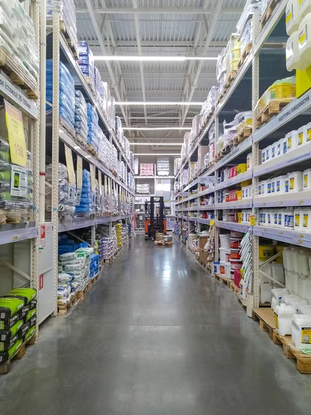 Row of shelves with construction goods in warehouse store — Stock Photo, Image