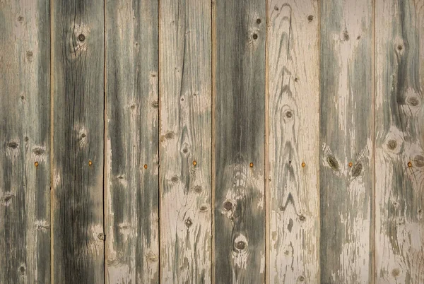 Leeftijd donkerbruin gebarsten houten planken closeup — Stockfoto