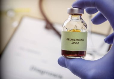Doctor hold vial of dexametasona in a hospital. Conceptual image clipart