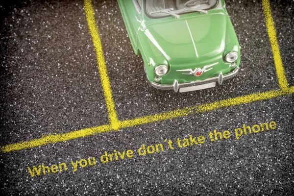 Road safety at the wheel, when driving do not take the mobile, conceptual image