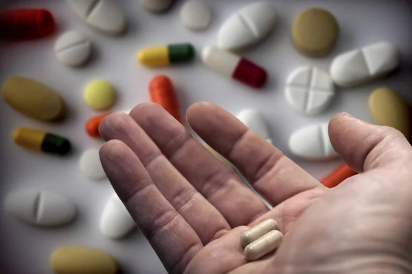 Middle Aged Man Hand Holding Two Pills Taking Daily Medication — Stock Photo, Image