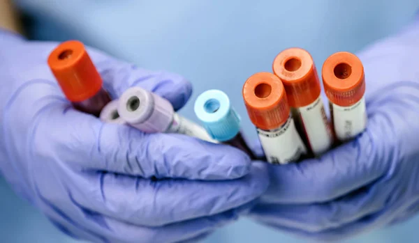 Several blood samples along with needle, conceptual image — Stock Photo, Image