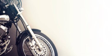 motorcycle on white with copy space, vintage effect on wall background clipart