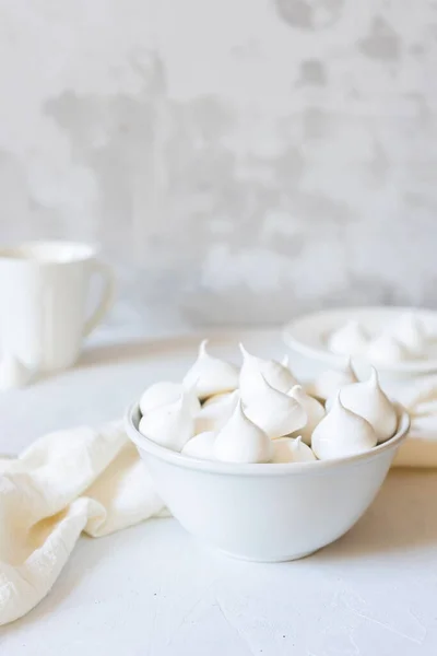 White meringue in white dish on white background