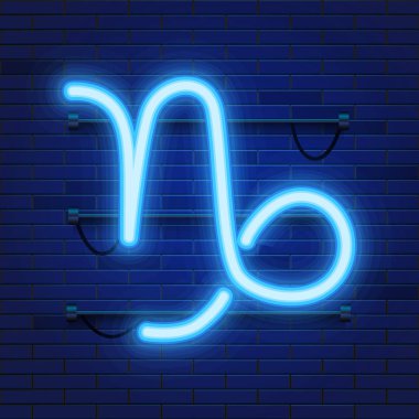 Parlayan kozmik neon Zodyak Oğlak sembolü tuğla duvar arka plan mavi. Astroloji kavramı.