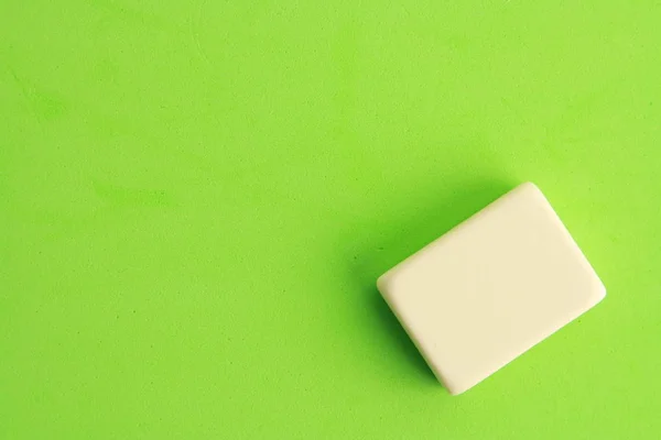 white eraser on color background