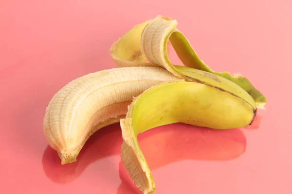 open banana on colorful background