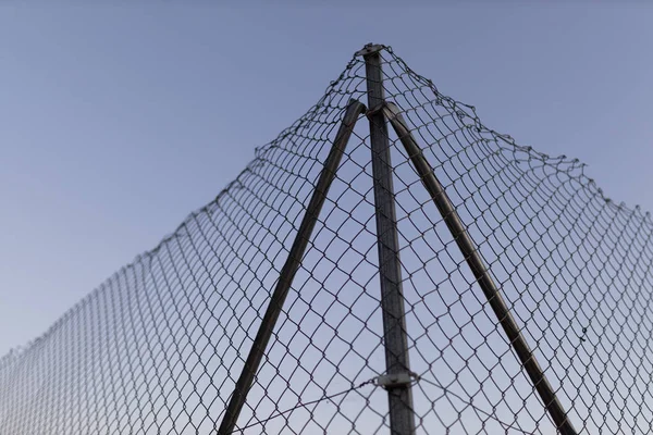 Wire fence at sunset with unfocused background — Stock Image Wire Fence Sunset Unfocused Background Royalty Free Stock Images