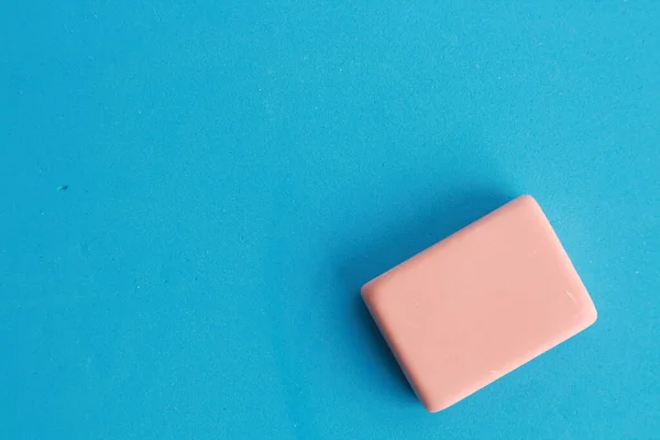 pink eraser on colorful background