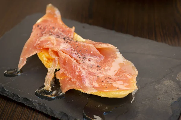 Closeup of toast served Salmon with oil — Stock Photo, Image