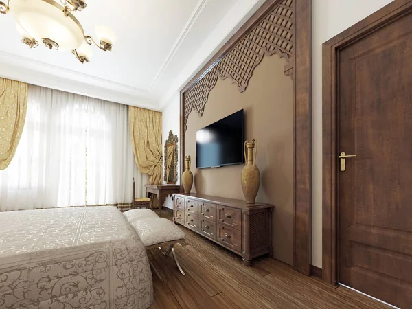 A TV set on the wall and a TV stand with wooden carvings of a Middle Eastern Arabic style. 3D rendering.
