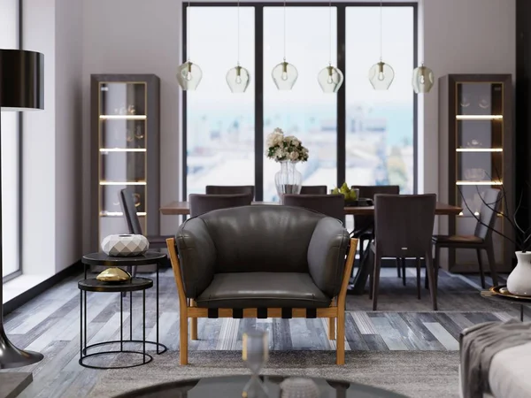A comfortable loft-style armchair with wooden legs and soft leather upholstery, next to a low table with decor and a black floor lamp and a dining table in the dining room. 3d rendering.