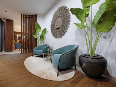 Otel dinlenme alanında iki tasarımcı koltuk mavi bir saksı bitki ve bir zeokal beyaz bir duvar üzerinde bulunmaktadır. 