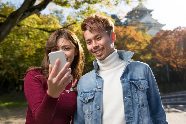 Young Japanese Couple Dating Outdoors — Stock Photo, Image