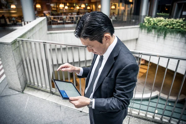 Japanese businessman walking outdoors - Asian man with elegant suit