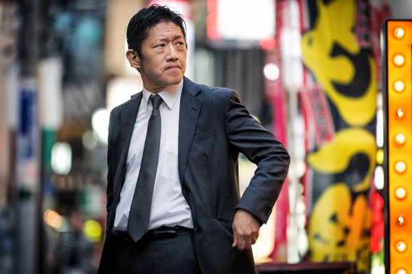 Japanese businessman walking outdoors - Asian man with elegant suit