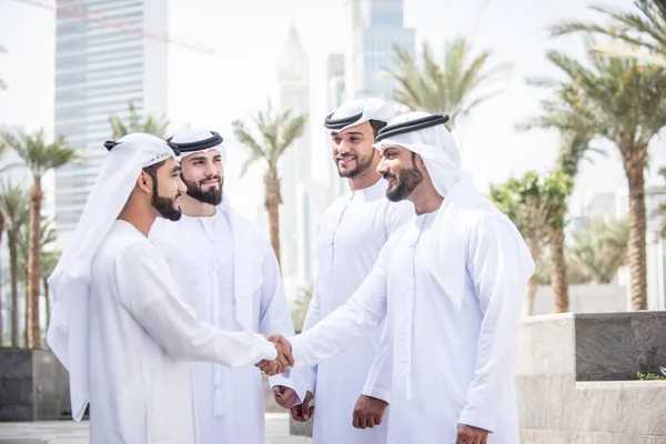 Arabian men meeting and talking about business - Businessmen portrait in Dubai