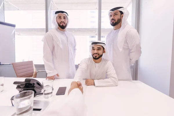 Arabian men meeting and talking about business - Businessmen portrait in Dubai