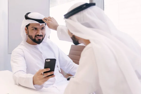 Arabian men meeting and talking about business - Businessmen portrait in Dubai