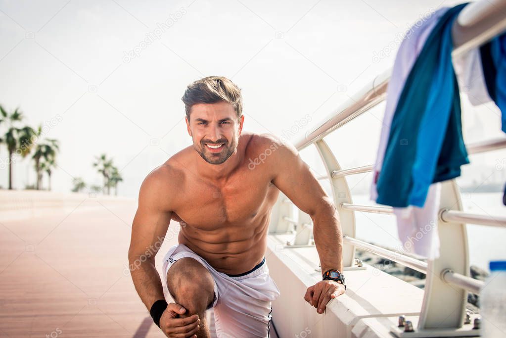 Athletic man doing sport outdoors