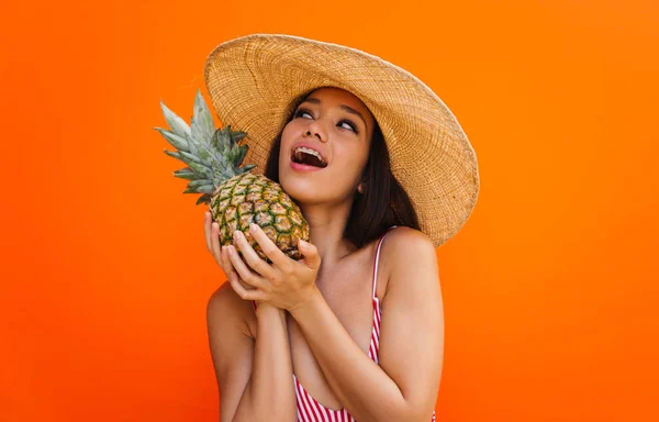 Beautiful asian young woman with bikini. Portraits on colored backgrounds