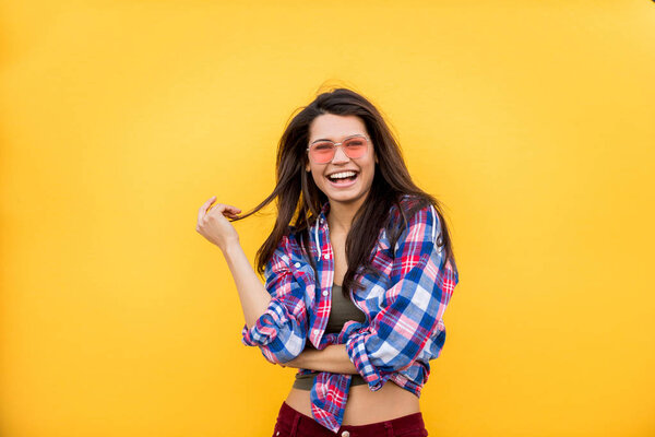 Portrait of stylish pretty girl on colored background - Happy woman with urban styled attire, concepts about lifestyle and youth