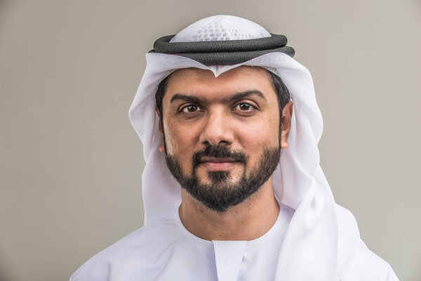 Portrait of arabic man with kandora in a studio