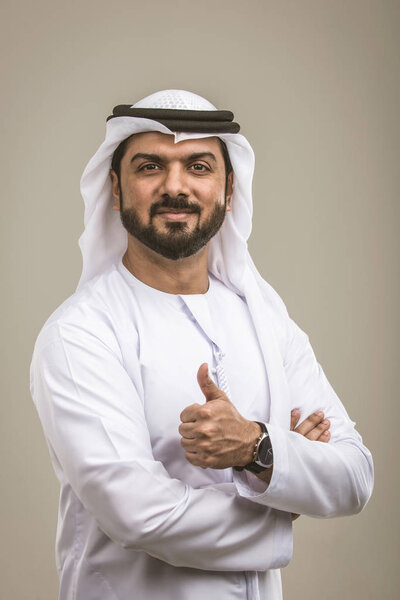 Portrait of arabic man with kandora in a studio