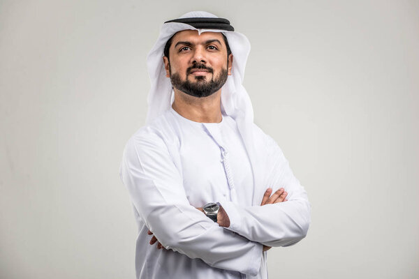 Portrait of arabic man with kandora in a studio