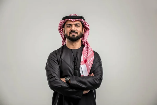 Portrait of arabic man with kandora in a studio