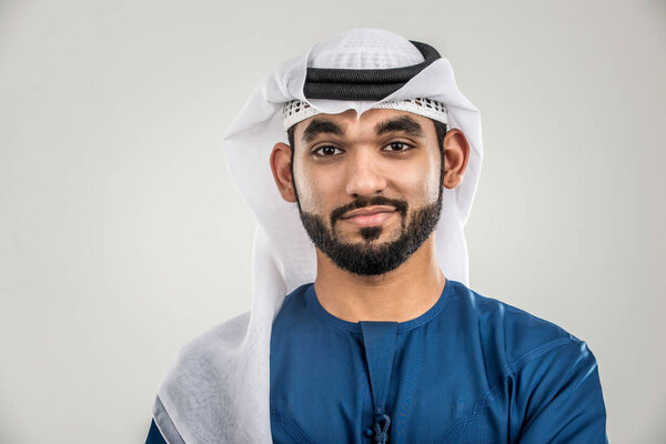 Portrait of arabic man with kandora in a studio
