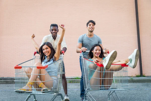 Multi Ethnic Group Friends Playing Shopping Carts Parking — Stock Photo, Image