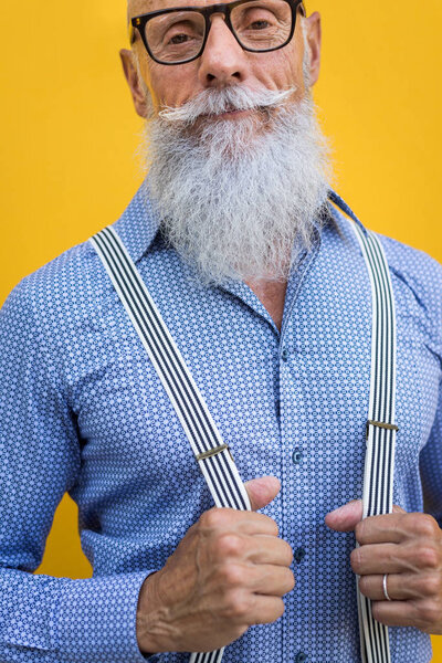 Handsome senior man portrait - Youthful and stylish man in the sixties, concepts about lifestyle, seniors and business