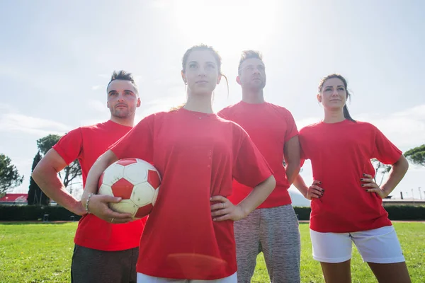 Football players training in soccer field, concepts about teamwork and sport