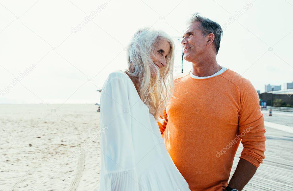 Happy senior couple spending time at the beach. Concepts about love,seniority and people