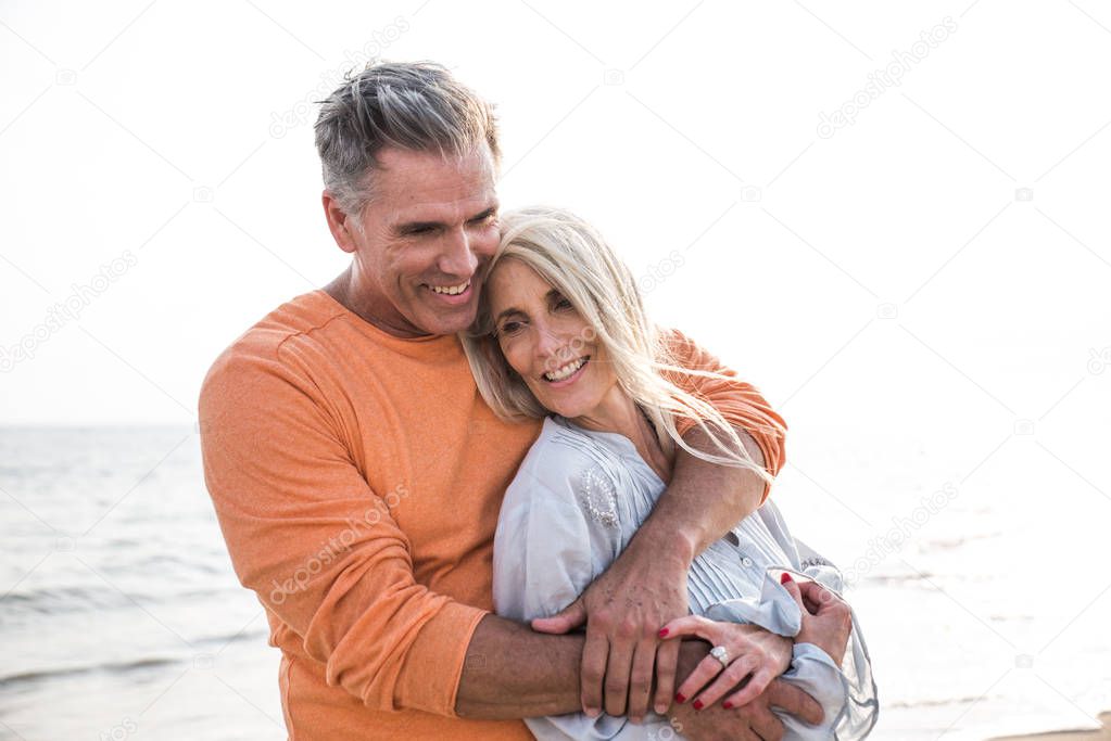 Happy senior couple spending time at the beach. Concepts about love,seniority and people