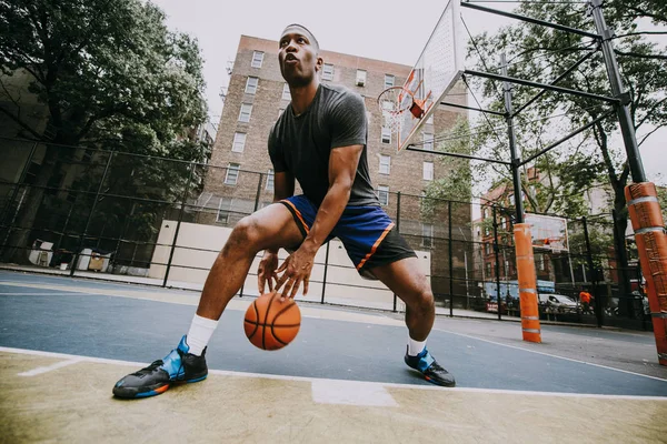 Basketball player training on a court in New york city